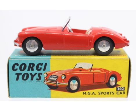 Corgi: A boxed, Corgi Toys, M.G.A. Sports Car, 302, red body, slight paint chips, box worn.