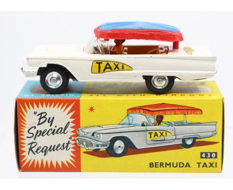 Corgi: A boxed, Corgi Toys, Bermuda Taxi, 430, white vehicle, blue and red canopy, vehicle appears good, box slightly worn.