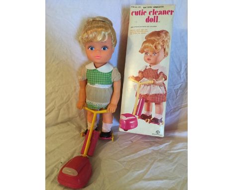 Barter Toys: A boxed, battery operated, 'Cutie Cleaner' Doll in original box, doll on roller skates pushing vacuum cleaner, s