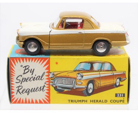 Corgi: A boxed, Corgi Toys, Triumph Herald Coupe, 231, white and gold body, red interior.