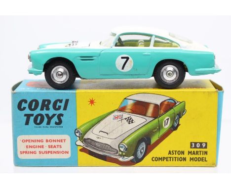 Corgi: A boxed, Corgi Toys, Aston Martin D.B.4. Competition Model, 309, in two-tone white and turquoise body. Race Number 7, 