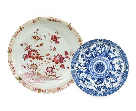 A Chinese Porcelain Dish, Kangxi, painted in underglaze blue with a lappet border containing animals under a band of prunus b