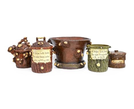 A Slipware Tobacco Jar and Cover, dated 1921, brown glazed, textured and modelled as a tree stump, inscribed "A pipe let's ta