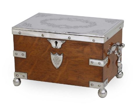 A Victorian Silver-Plate-Mounted Oak Tea Caddy, of rectangular form, the hinged cover engraved with a foliate wreath and with