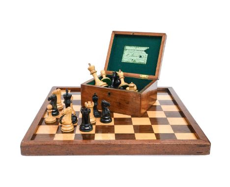 A Jaques Staunton Pattern Boxwood and Ebony Weighted Chess Set, two knights and two castles stamped with crowns picked out in