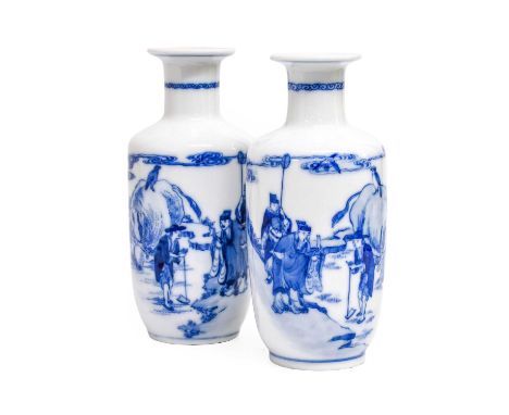 A Pair of Chinese Porcelain Rouleau Vases, 19th century, each painted in underglaze blue with three figures in a landscape an
