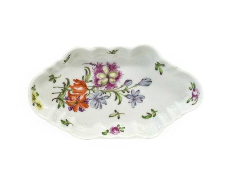 A Worcester Porcelain Spoon Tray, circa 1757, of fluted hexagonal form, painted with a flowerspray and scattered sprigs15cm w