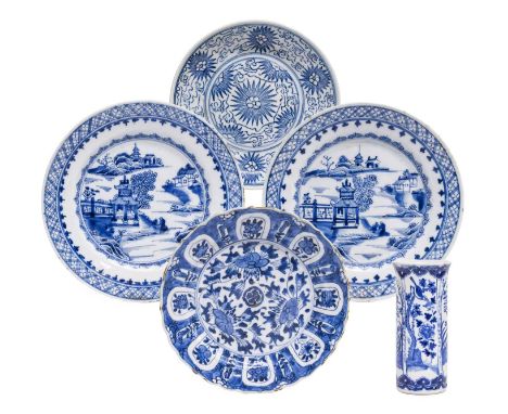 A Chinese Porcelain Plate, Kangxi, with barbed rim and painted in underglaze blue with three large stylized blooms under a wi
