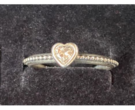 Pandora ring with white heart shaped stone 
