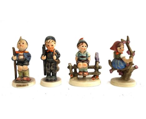 Four Goebel Hummel figurines, the tallest 10cmH, to include Little Hiker, Chimney Sweep, Wayside Harmony and Apple Tree Girl 