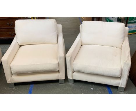 A pair of vintage Oscar Woollens, Finchley Road, contemporary armchairs upholstered in a white cord fabric, on chrome feet, 8