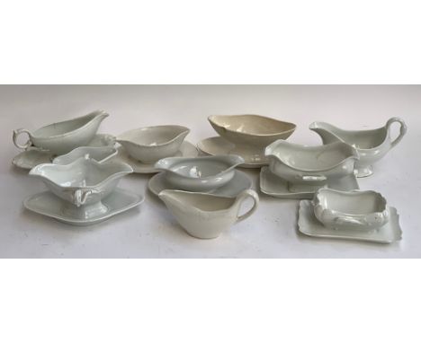 A collection of 10 antique ceramic gravy boats 