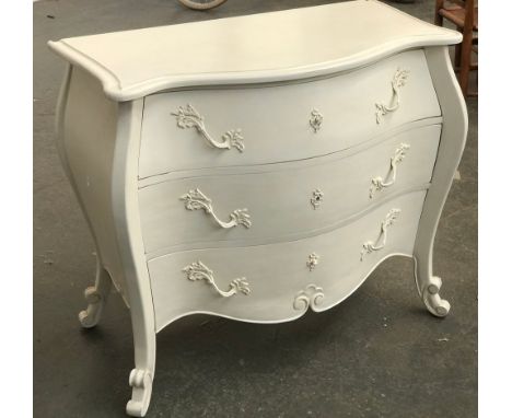 A 20th century white painted continental style commode chest of bombe form, with three drawers, 100x48x85cmH 