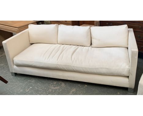 A vintage Oscar Woollens, Finchley Road, contemporary sofa upholstered in a white cord fabric, on chrome feet and casters, 21