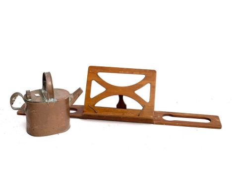 A vintage Army and Navy copper watering can; together with the Bershaw book rest 