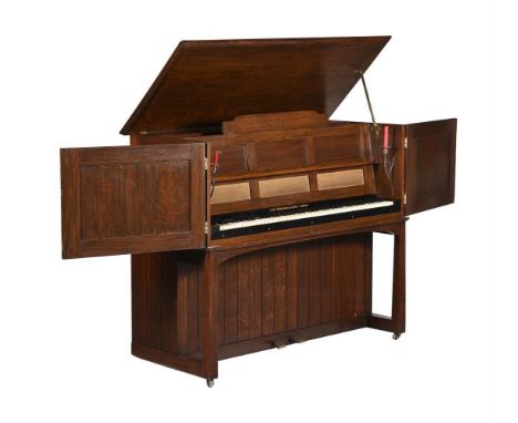 An oak and brass mounted upright piano c.1900, by Mackay Hugh Bailie Scott (1865-1945) for John Broadwood & Sons, Manxman, No