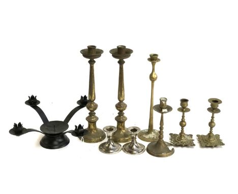 A quantity of brass candlesticks, the tallest pair 33cmH; together with a quantity of model wrought black and white painted m
