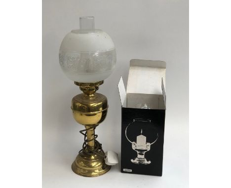 A gilt metal oil lamp, with chimney and shade, converted for electrical use; together with 'The candle lamp' boxed 