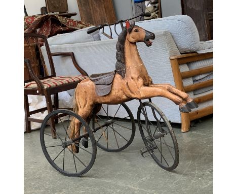 A vintage hobby horse tricycle with leather saddle, 88cmH 