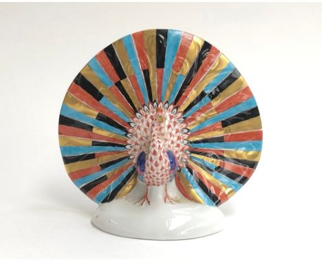 A ceramic hand painted Herend peacock, 11cm high 