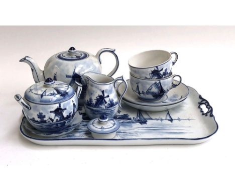 A Delft blue and white tea service, comprising teapot, cups, saucers, tray etc 