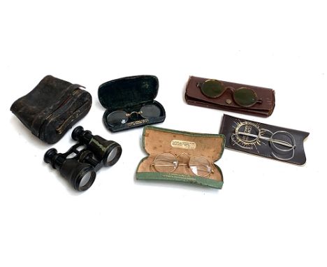 A pair of Perken Son &amp; Co Ltd London vintage binoculars; together with two pairs of rolled gold framed spectacles, on in 