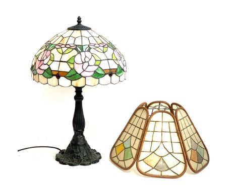 A Tiffany style stained glass lampshade, 41cmD on a spelter lamp base; together with a Capiz shade, 41cmD 