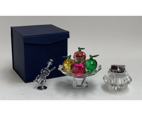 A Crystocraft violin; similar crystal fruit on a spinning stand, 12.5cmH; and a glass table lighter 