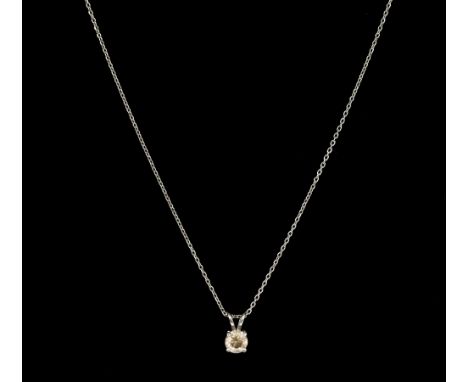 A fancy light brown diamond and 18ct white gold solitaire pendant, comprising a round brilliant cut diamond weighing approx 0