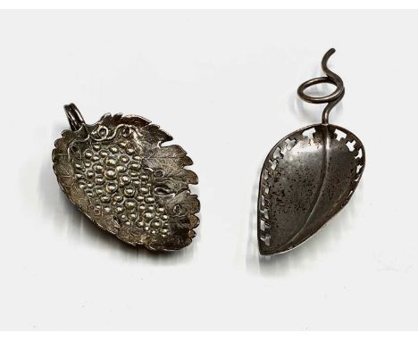 A silver vine embossed caddy spoon by Joseph Willmore Birmingham 1808 together with a rare Sheffield plated caddy spoon in th