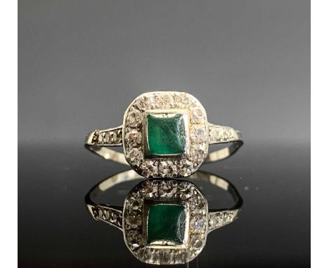 An 18ct white gold art deco emerald and diamond ring.Approx size: R1/2Condition report: Damaged, split on shank just below on