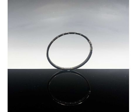 A contemporary 18ct white gold hinged bangle set with diamonds 19.3gmCondition report: Internal maximum diameter of 58mm. The