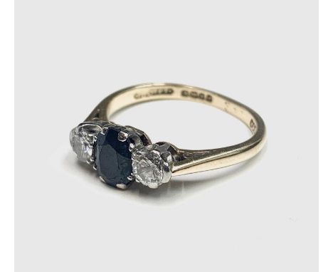 An 18ct gold sapphire and diamond ring.