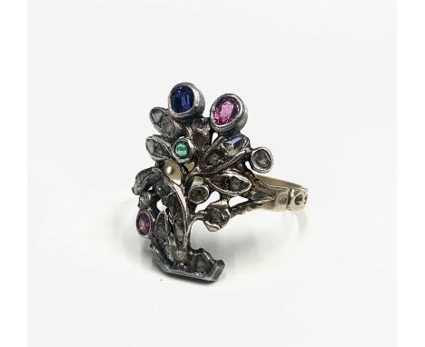 A giardinetti  ring in the style of the mid 18th century with a floral design set with many diamonds and coloured stones, all