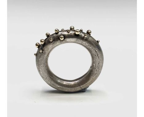 A contemporary silver and gold bead ring 15gmCondition report: There are no marks on the rings. The ring is approximately an 