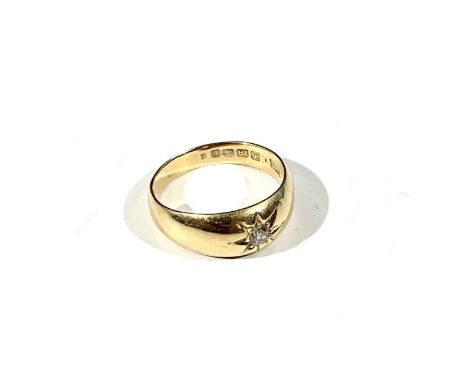 An 18ct gold ring gypsy set a diamond 5.8gm