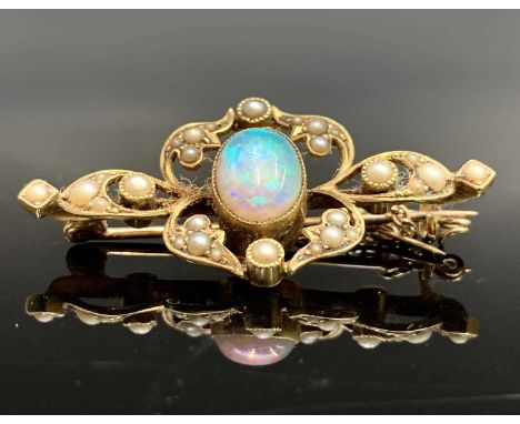 A Victorian 15ct gold brooch with central oval opal amongst pearl set foliage 40mm 5.3gm