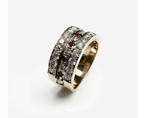 A 14ct gold triple band half hoop eternity ring set a total of twenty-nine diamonds and nine rubies 8.7gm.Approx size: O