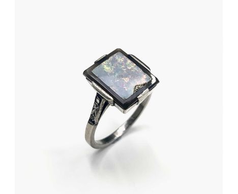 An art deco opal veneered white gold ring with diamond shoulders