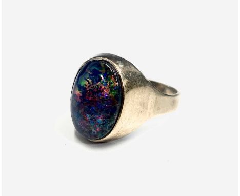 A gentleman's 9ct gold ring set an opal doublet 8.9gmsCondition report: Size X-Y. The gold band is fine and not particularly 