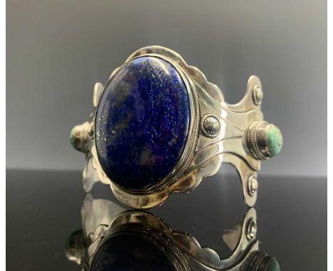 A silver Mexican style lapis and matrix turquoise bangle, 67gm unmarked