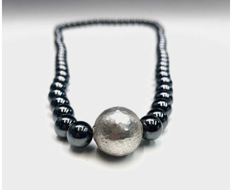 A Tiffany & Co Paloma Picasso designed necklace with signed hammered silver bead and hematite beads 38cm hallmarked 2004Tiffa