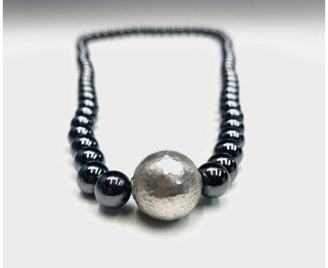 A Tiffany & Co Paloma Picasso designed necklace with signed hammered silver bead and hematite beads 38cm hallmarked 2004Tiffa