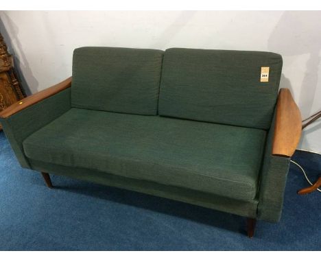 A teak two seater sofa bed