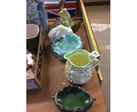 A Falconware grotesque jug, lamp base etc.