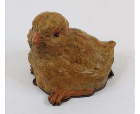 A painted bronze stamp box, in the form of a chick