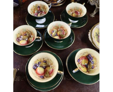 Six Aynsley cabinet cups and saucers, the interiors of the cups decorated with fruit, and two extra saucers