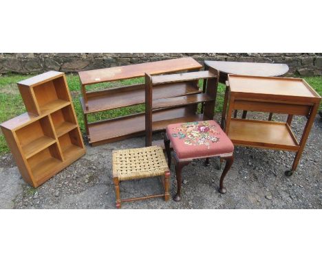 A collection of furniture to include waterfall set of shelves, card table, stool, etc
