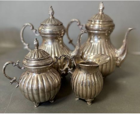 A Four Piece Silver tea service marked 925, with teapot AF, hot water jug, milk jug and sugar bowl. Approximate Total weight: