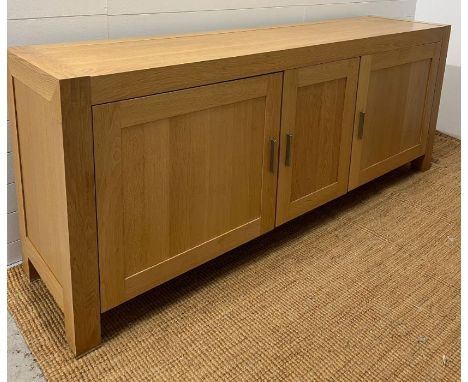 A large light oak sideboard with chrome handles (H90cm W226cm D53cm)
